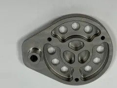 Finished anonymized AerMet 100 precision component after fine steel-bead blasting