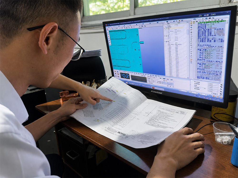 Custom precision parts quote review with drawing, engineering screen, and technical evaluation